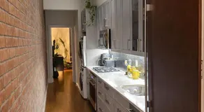 Sunlit Luxury 2BR Harlem Brownstone Retreat - Near Express Trains - Image 2