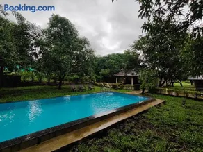 SaffronStays Mango Huts by the River, Pali - Image 1