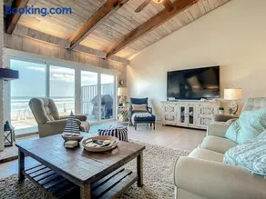 Beachfront Deck with steps down to the white sandy beach Sea Dunes Sandcastle 1A - Image 3