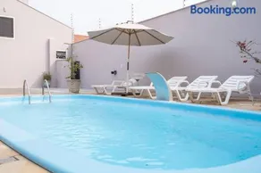 Casa Completa com Piscina Churrasqueira Sinuca Wi-Fi e Garagem para 4 Carros a 350m da Praia Acomoda 12 Pessoas, 4 Quartos com Ar-Condicionado - Image 2