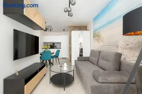 Seaside Apartment with Parking, Air Conditioning and Elevator Close to the Beach by Noclegi Renters - Image 1