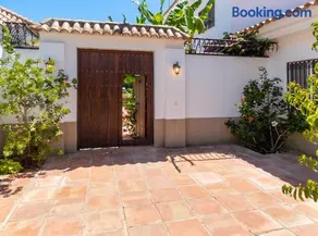 Elegant Villa in Nuevo Portil with Shared Pool - Image 3
