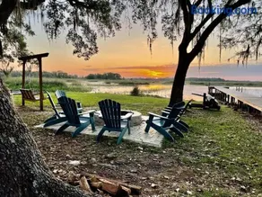 PERFECT POINTE LAKEHOUSE Waterfront Apoka Lake with dock, screened patio, firepit, large garage with boat parking, gas grill, home sleeps 8 in 1 king and 3 twins, amazing sunrise views and dock fishing, large home great for family gatherings, 1 dog w fee - Image 1