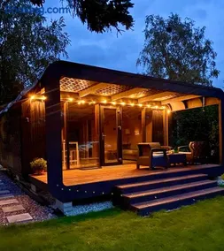 A tiny house with a garden and a hot tube - Image 1