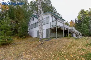 Lakefront cabin with private boat ramp, lake access, wrap-around porch, firepit - Image 1