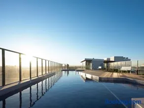 Modern Inner City Resort Near Train with Free Parking and Rooftop Pool - Image 3