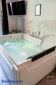 Lush Escape Suites - hottube and sauna - Image 1