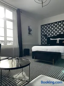 Hôtel Échappée en Baie - Chambres climatisées -Parking privé gratuit dont forfaits bornes électriques réservable - Image 1