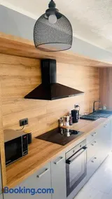 Modern Apartment with Fireplace & Stylish Kitchen - Image 3