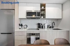 Sleek 2BR Condo with Balcony & Skyline Views - Image 3