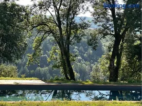 Maison bois avec vue lac Piscine - Image 1