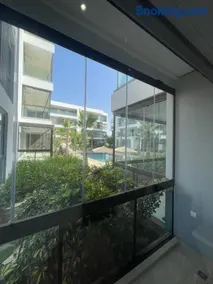 Appartement Luxe Vue Piscine Résidence Les Perles de Bentriaa, El Mansouria - Image 5