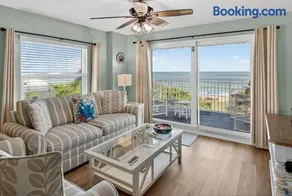 Direct oceanfront 2/2 corner condo with large balcony, heated pool, and garage parking - Image 1