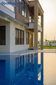 ELIVAAS Signature Lush Haven 4 BHK Villa Private Pool, Terrace & Landscaped Garden - Image 1