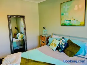 A Little Bit Beachy Modern Guest Room and Private Toilet - Image 1