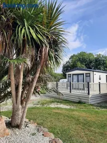 Sunset retreat lodge with large wrap around decking - Image 2