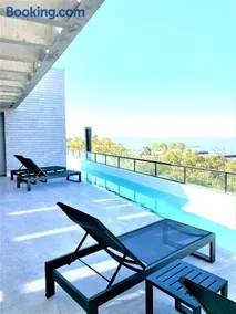 Stylish Apartment by River with Pool & Grill - Image 1