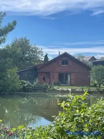 Chalet au bord d'un étang - Image 5