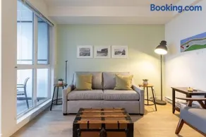 Urban Stay With Balcony And In-Unit Laundry - Image 1