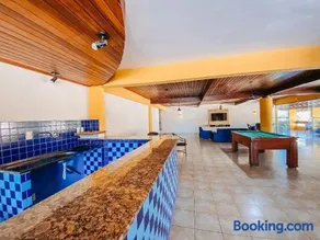 Flat's com 1 quarto, frente praia de Taperapuã, atravessou a rua está na praia, Condomínio Boulevard da Praia conta com piscina, sauna, sala de jogos além de café da manhã como cortesia - Image 5