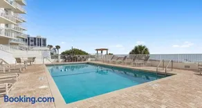 Direct oceanfront 2/2 corner condo with large balcony, heated pool, and garage parking - Image 3
