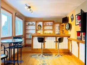 Canalside Summer Cottage with Waterview, Custom Bar, BBQ, and Fireplace - Image 4