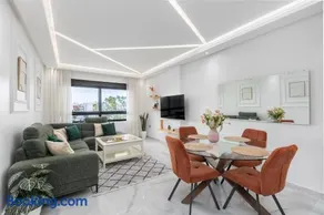 Seaview 2BR Apt Near Beach, AC, Pool, Balcony - Image 1