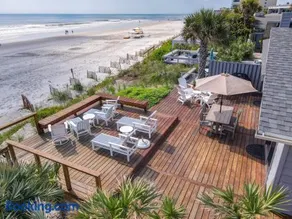 Beachfront Deck with steps down to the white sandy beach Sea Dunes Sandcastle 1A - Image 1