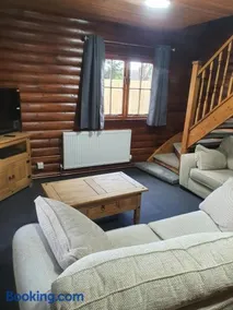 large log cabin overlooking a fishing lake - Image 1