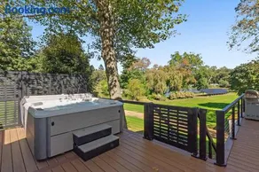 Modern Waterfront Retreat with Hot Tub & Pond Views - Image 2