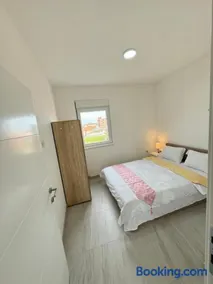 Luxury apartment just 5 minutes from Belgrade Airport featuring a large TV two bedrooms and a swimming pool - Image 3