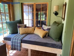 Cabin in the woods with fire pit and porch - Image 3