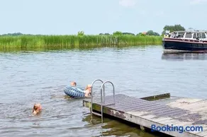 Glamping Safarilodge 'Grutte Fiif' met airco, extra keuken op veranda en privé achtertuin - Image 4