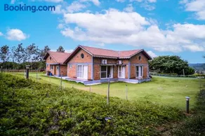 SaffronStays Amodhini Farmstay - Image 1