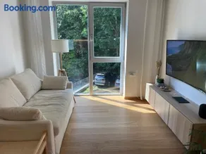 Sunny apartment with forest view - Image 1
