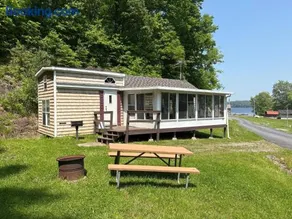 Classic Camper on Black Lake - Image 1