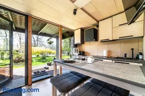 A tiny house with a garden and a hot tube - Image 3