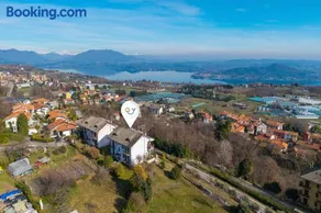 La Mansarda Sul Lago: Rustic Attic Studio with Balcony & Parking - Happy Rentals - Image 1