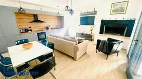 Modern Apartment with Fireplace & Stylish Kitchen - Image 4