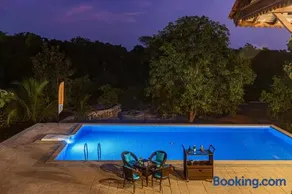 SaffronStays Vedika - 4BR riverfront pool villa with kaya king bullock ride & BBQ near Pinjal River, Vikramgad - Image 4