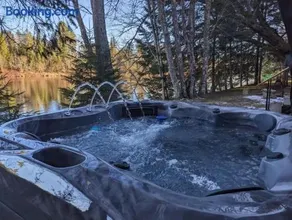 Riverfront Getaway with Hot Tub and Scenic Views - Image 1