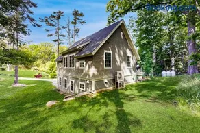 Brand new guest apartment with furnished deck, fast WIFI, dock, & water views - Image 1