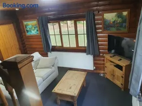 large log cabin overlooking a fishing lake - Image 1