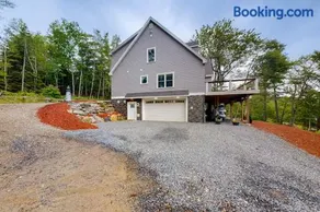 Luxurious waterfront home with deck, firepit, hot tub, fireplace, & pool table - Image 1