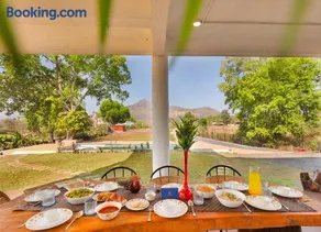 SaffronStays Deckhouse 47 - 3BR pet-friendly industrial-style pool villa with bonfire, BBQ, rain dance & celebration turf - Image 3