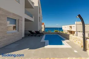 Dolphin view with a pool by the beach - Image 1
