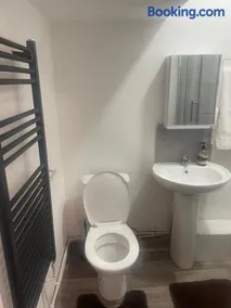 studio apartment with small kitchen and bathroom - Image 5