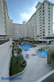 Flat completo no centro com piscinas e lazer - Image 1