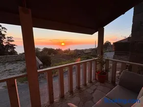 Tiny house with sunset over the ocean - Image 5