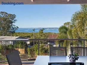 Coastal Family Escape with Pool Balcony and Bay Views - Image 2